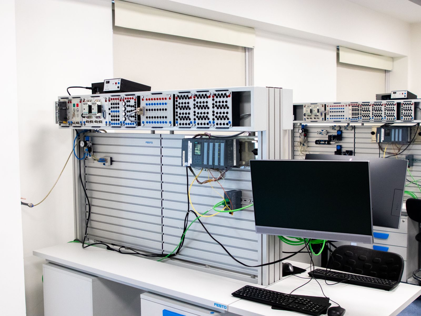Office computer workstation and server rack representing business IT equipment