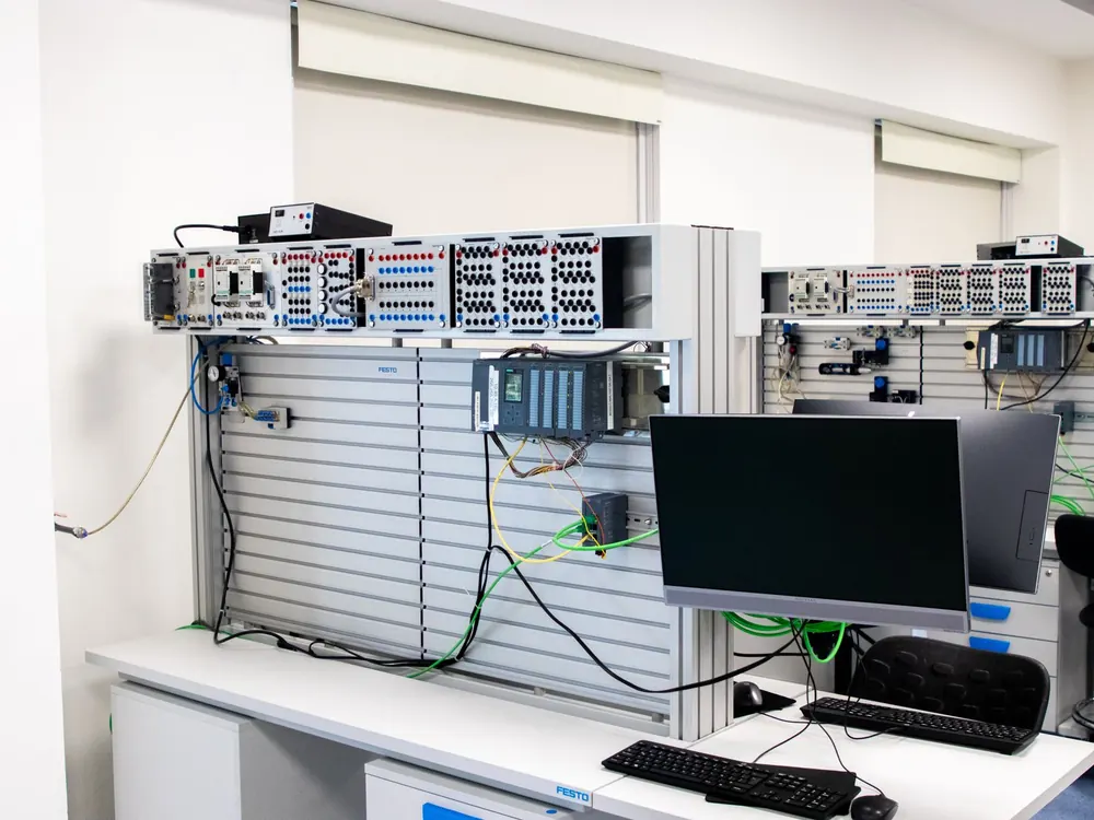 Office computer workstation and server rack representing business IT equipment